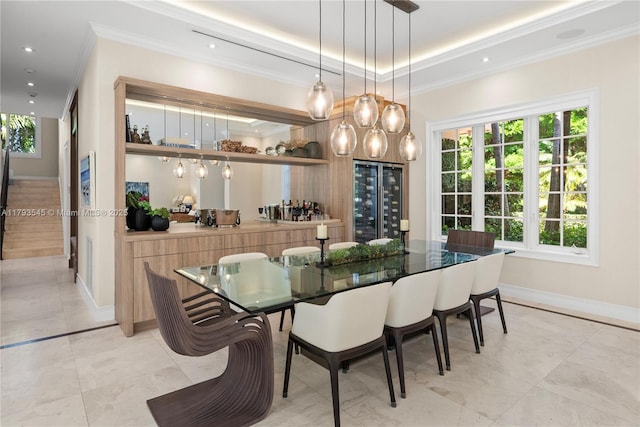 7120 Mira Flores Ave, Coral Gables, FL 33143 - dining space featuring crown molding, beverage cooler, plenty of natural light, baseboards, and a tray ceiling
