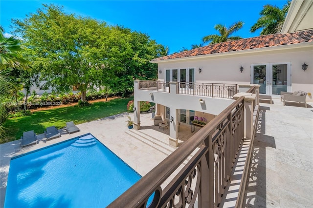 7120 Mira Flores Ave, Coral Gables, FL 33143 - swimming pool featuring french doors, a patio, and a lawn