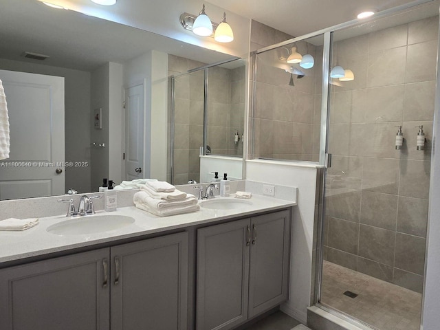 726 Longboat, Davenport, FL 33896 - bathroom featuring double vanity and a stall shower