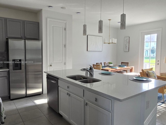 726 Longboat, Davenport, FL 33896 - kitchen with stainless steel appliances, light tile patterned floors, a center island with sink, and pendant lighting