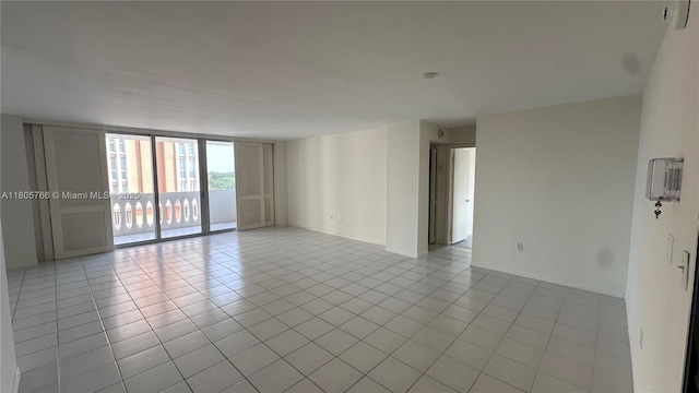 625 Biltmore Way Unit 707, Coral Gables, FL 33134 - spare room with light tile patterned floors and floor to ceiling windows