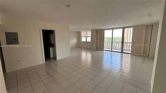 625 Biltmore Way Unit 707, Coral Gables, FL 33134 - unfurnished room with light tile patterned floors, expansive windows, and electric panel