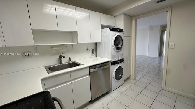 625 Biltmore Way Unit 707, Coral Gables, FL 33134 - kitchen with stacked washer / drying machine, light tile patterned flooring, dishwasher, light countertops, and stove