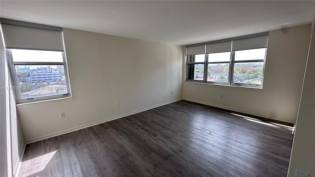 625 Biltmore Way Unit 707, Coral Gables, FL 33134 - unfurnished room featuring dark wood finished floors and baseboards