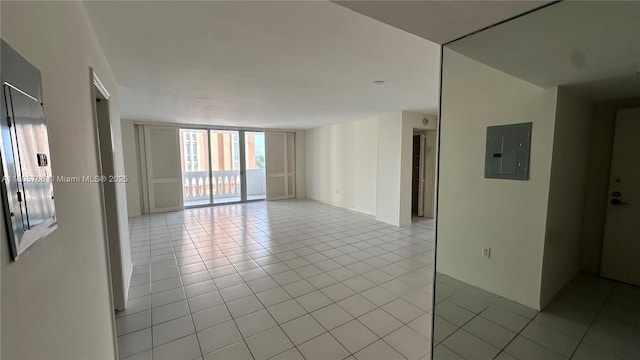 625 Biltmore Way Unit 707, Coral Gables, FL 33134 - unfurnished room featuring a wall of windows, electric panel, and light tile patterned floors