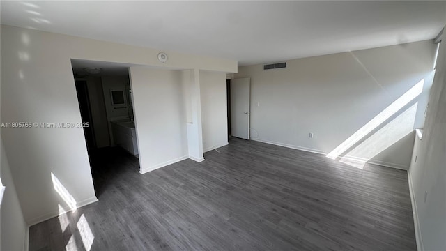 625 Biltmore Way Unit 707, Coral Gables, FL 33134 - unfurnished room featuring dark wood-style flooring and baseboards