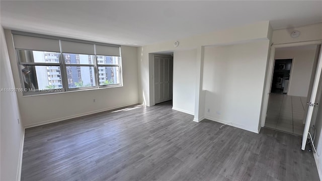 625 Biltmore Way Unit 707, Coral Gables, FL 33134 - unfurnished bedroom featuring wood finished floors and baseboards