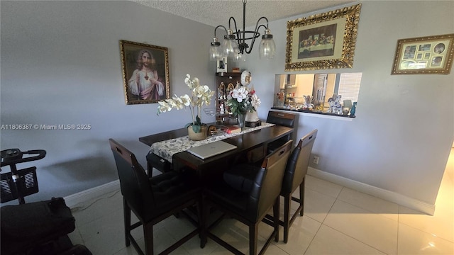 12500 SW 5th Ct Unit 307M, Pembroke Pines, FL 33027 - dining area with a textured ceiling, tile patterned floors, baseboards, and a chandelier
