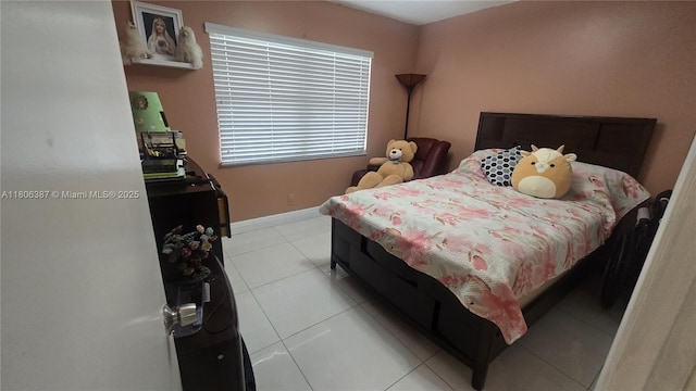 12500 SW 5th Ct Unit 307M, Pembroke Pines, FL 33027 - bedroom featuring light tile patterned floors and baseboards