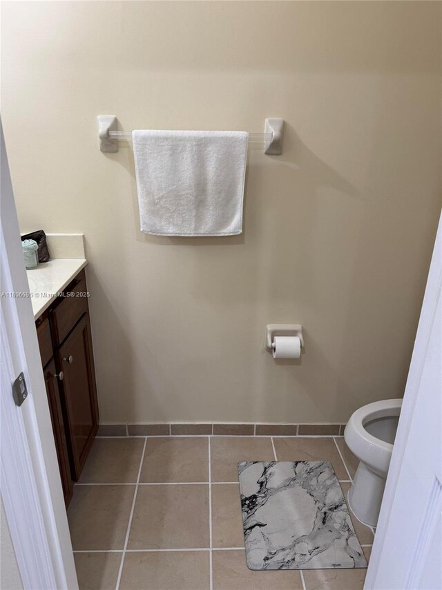 11564 SW 151st Ave, Miami, FL 33196 - bathroom with tile patterned flooring, baseboards, vanity, and toilet