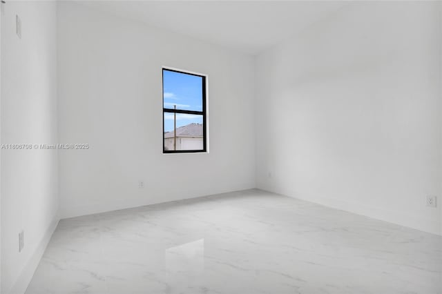 2518 26th St W, Lehigh Acres, FL 33971 - spare room with marble finish floors and baseboards