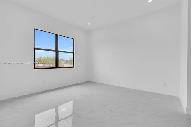 2518 26th St W, Lehigh Acres, FL 33971 - unfurnished room with recessed lighting, light marble finish floors, and baseboards