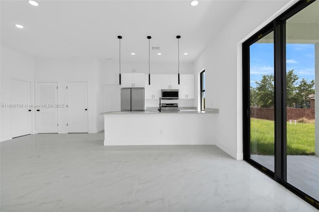 2518 26th St W, Lehigh Acres, FL 33971 - kitchen featuring appliances with stainless steel finishes, light marble finish floors, recessed lighting, white cabinets, and modern cabinets