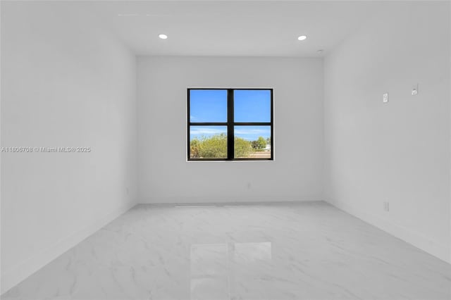2518 26th St W, Lehigh Acres, FL 33971 - unfurnished room featuring light marble finish flooring, baseboards, and recessed lighting