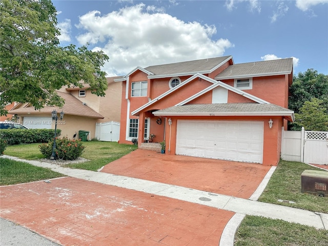 9731 SW 13th St, Pembroke Pines, FL 33025 - multi unit property with stucco siding, decorative driveway, and a gate