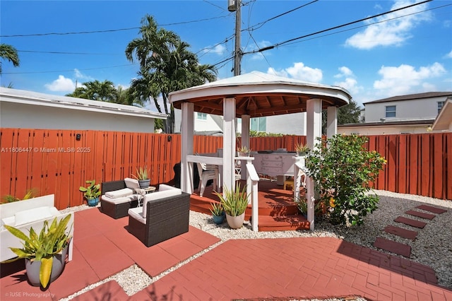 1727 SW 11th Ter, Miami, FL 33135 - fenced backyard featuring a gazebo, an outdoor hangout area, and a patio