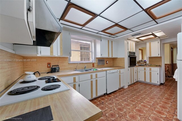 1727 SW 11th Ter, Miami, FL 33135 - kitchen with white appliances, ventilation hood, a sink, light countertops, and white cabinets