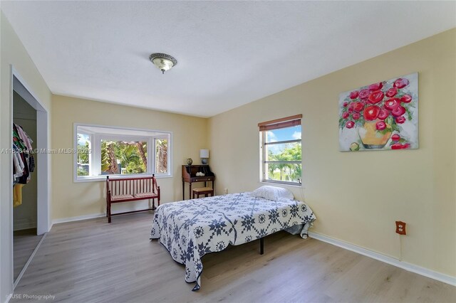 1727 SW 11th Ter, Miami, FL 33135 - bedroom featuring light wood finished floors and baseboards