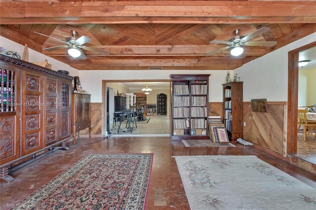 1727 SW 11th Ter, Miami, FL 33135 - foyer entrance featuring a wainscoted wall, a ceiling fan, a chandelier, wood ceiling with exposed beams, and wooden walls
