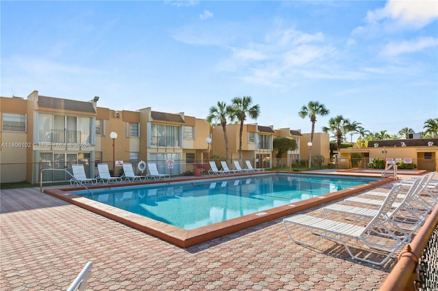 9310 W Flagler St Unit 111A, Miami, FL 33174 - community pool with a residential view and a patio area
