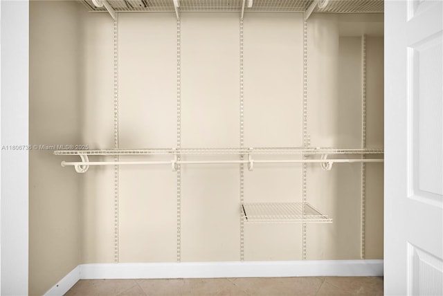 1559 Michigan Ave Unit 303, Miami Beach, FL 33139 - walk in closet featuring tile patterned flooring