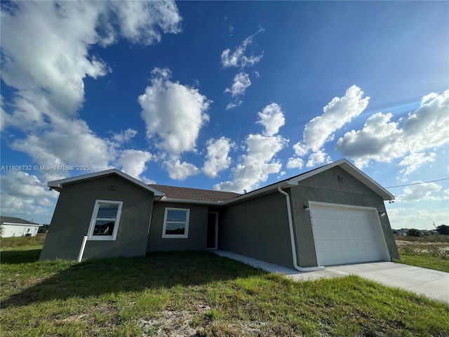 1818 Inwood Rd, La Belle, FL 33935 - ranch-style home featuring an attached garage, stucco siding, a front lawn, and driveway