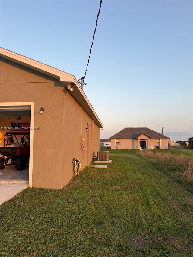 1818 Inwood Rd, La Belle, FL 33935 - yard at dusk with a lawn