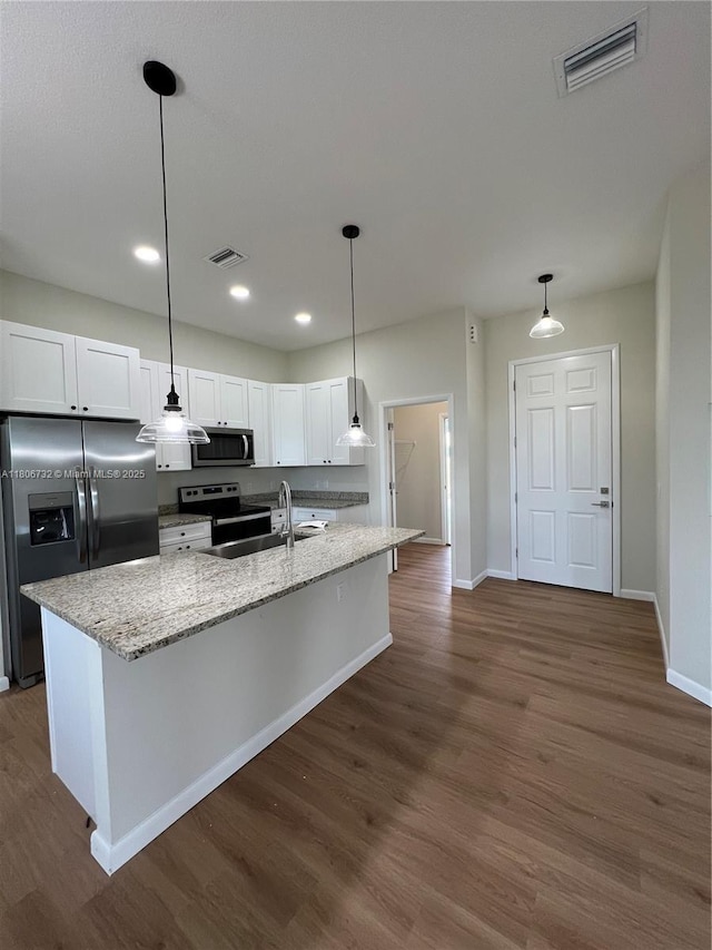 1818 Inwood Rd, La Belle, FL 33935 - kitchen with appliances with stainless steel finishes, baseboards, white cabinets, dark wood-type flooring, and recessed lighting
