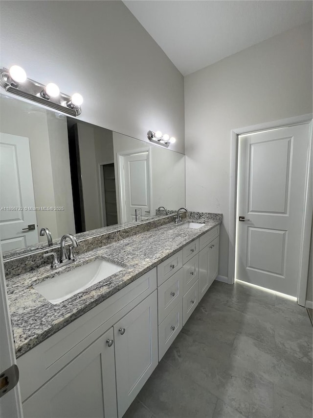 1818 Inwood Rd, La Belle, FL 33935 - bathroom featuring double vanity and baseboards