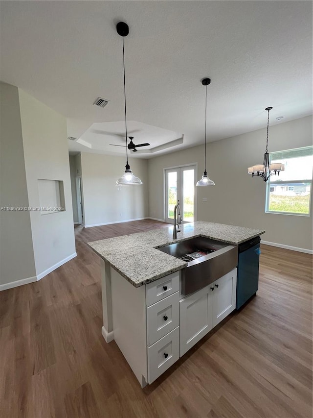 1818 Inwood Rd, La Belle, FL 33935 - kitchen featuring dishwasher, wood finished floors, a sink, and baseboards