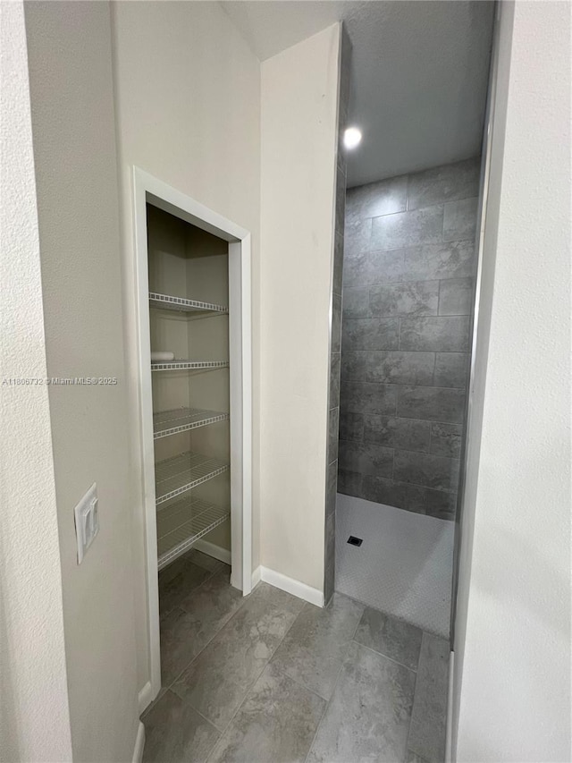 1818 Inwood Rd, La Belle, FL 33935 - full bathroom featuring a walk in shower and baseboards