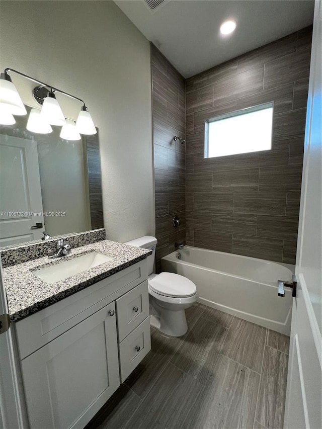1818 Inwood Rd, La Belle, FL 33935 - full bathroom featuring washtub / shower combination, vanity, and toilet