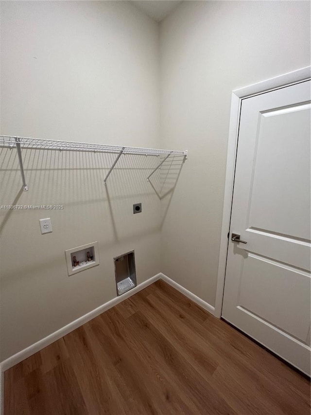 1818 Inwood Rd, La Belle, FL 33935 - laundry area with hookup for an electric dryer, wood finished floors, baseboards, and hookup for a washing machine