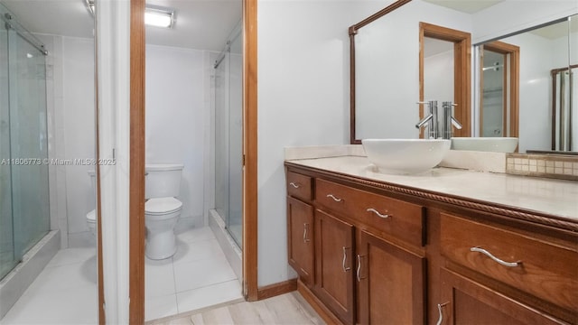 8605 W Sample Rd Unit 202, Coral Springs, FL 33065 - full bathroom with toilet, a stall shower, vanity, and tile patterned flooring