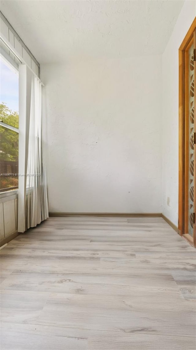8605 W Sample Rd Unit 202, Coral Springs, FL 33065 - unfurnished room with light wood finished floors and baseboards