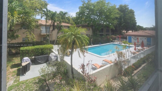 8605 W Sample Rd Unit 202, Coral Springs, FL 33065 - community pool with a patio area