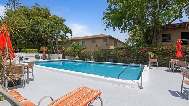 8605 W Sample Rd Unit 202, Coral Springs, FL 33065 - community pool with a patio area