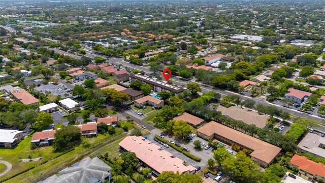 8605 W Sample Rd Unit 202, Coral Springs, FL 33065 - aerial view of property and surrounding area with nearby suburban area