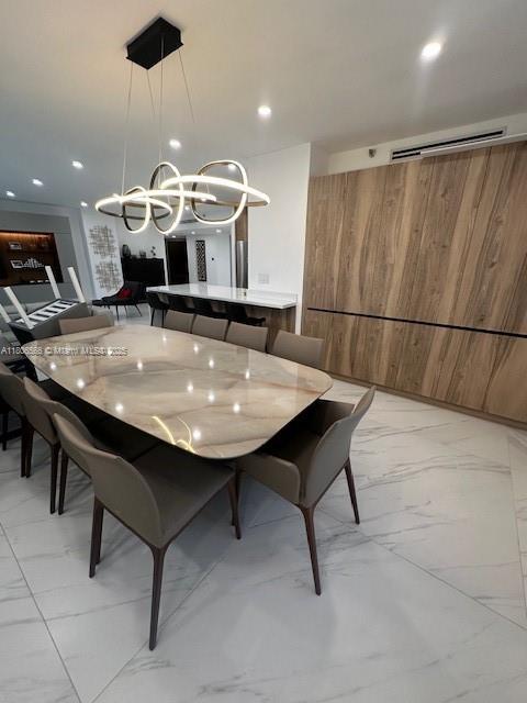 19500 Turnberry Way Unit 12A, Aventura, FL 33180 - dining space featuring light marble finish flooring, a chandelier, and recessed lighting
