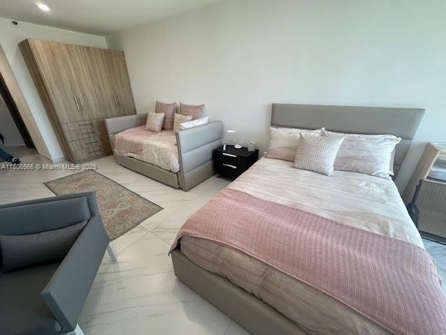 19500 Turnberry Way Unit 12A, Aventura, FL 33180 - bedroom featuring light marble finish floors