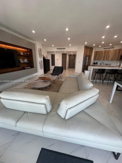 19500 Turnberry Way Unit 12A, Aventura, FL 33180 - living room featuring recessed lighting and light marble finish floors