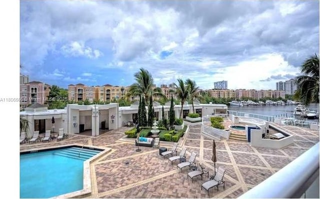 19500 Turnberry Way Unit 12A, Aventura, FL 33180 - community pool featuring a patio area and a water view