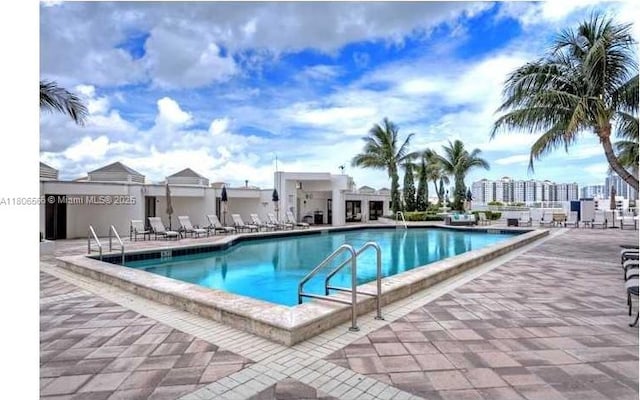 19500 Turnberry Way Unit 12A, Aventura, FL 33180 - community pool featuring a patio