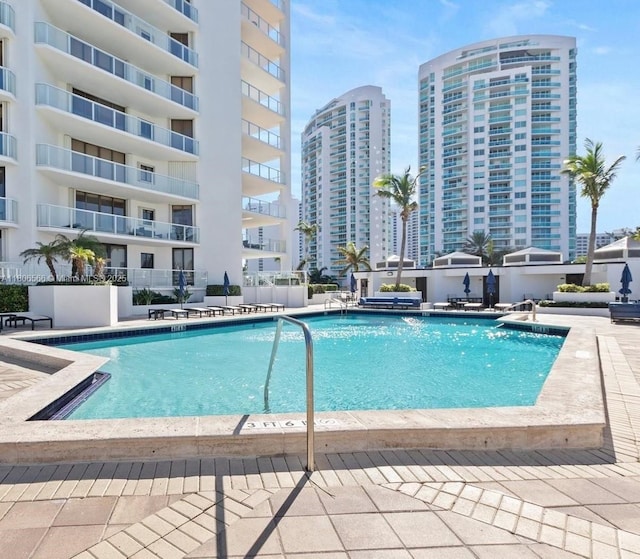 19500 Turnberry Way Unit 12A, Aventura, FL 33180 - community pool featuring a patio