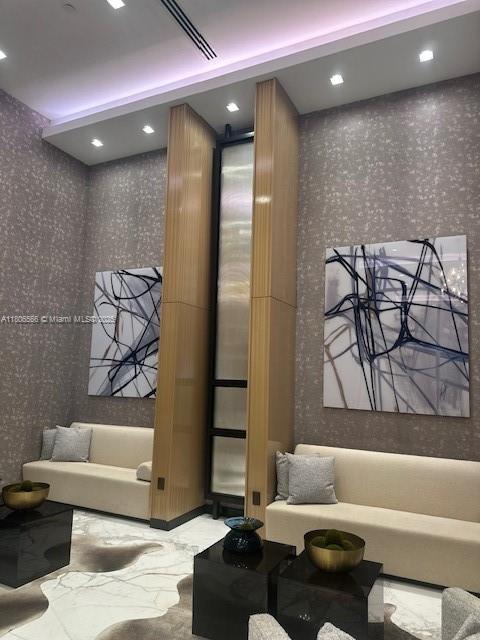 19500 Turnberry Way Unit 12A, Aventura, FL 33180 - common area with wallpapered walls and recessed lighting