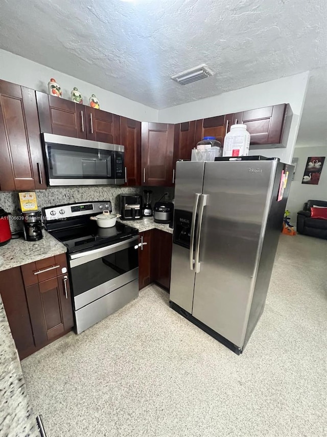 2990 W 7th Ave, Hialeah, FL 33012 - kitchen with stainless steel appliances and a textured ceiling