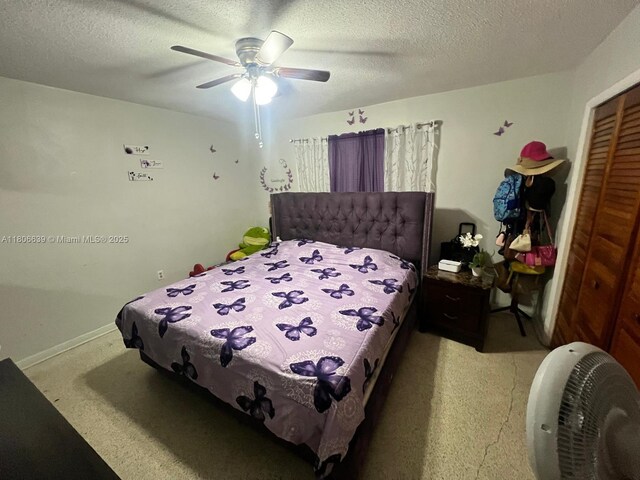 2990 W 7th Ave, Hialeah, FL 33012 - bedroom with light carpet, a closet, a ceiling fan, a textured ceiling, and baseboards