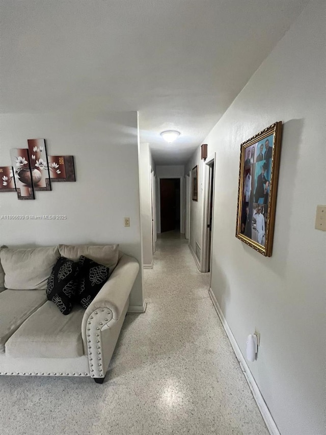 2990 W 7th Ave, Hialeah, FL 33012 - corridor with speckled floor and baseboards