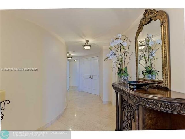 2100 N Ocean Blvd Unit 5B, Fort Lauderdale, FL 33305 - hallway featuring baseboards