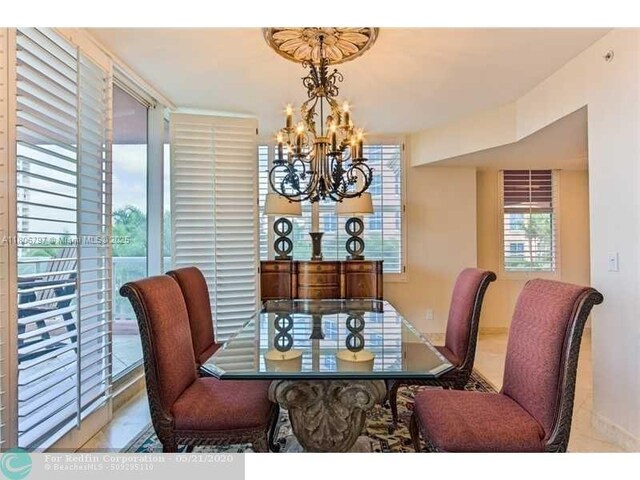 2100 N Ocean Blvd Unit 5B, Fort Lauderdale, FL 33305 - dining area with a chandelier
